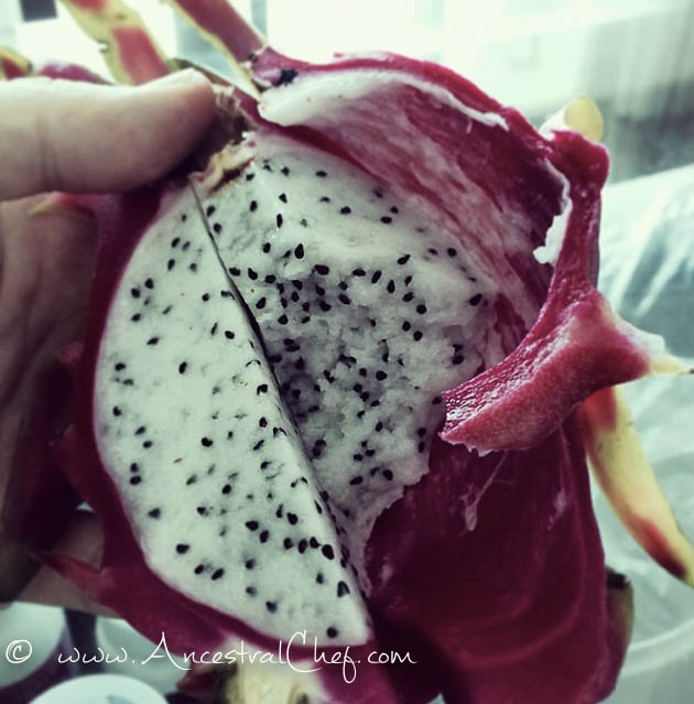 dragon fruit pitaya with pink skin and white flesh and black seeds