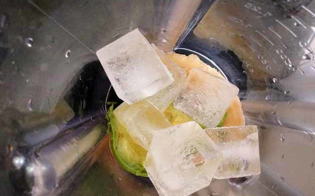 Place the avocado, banana, and ice into the blender.