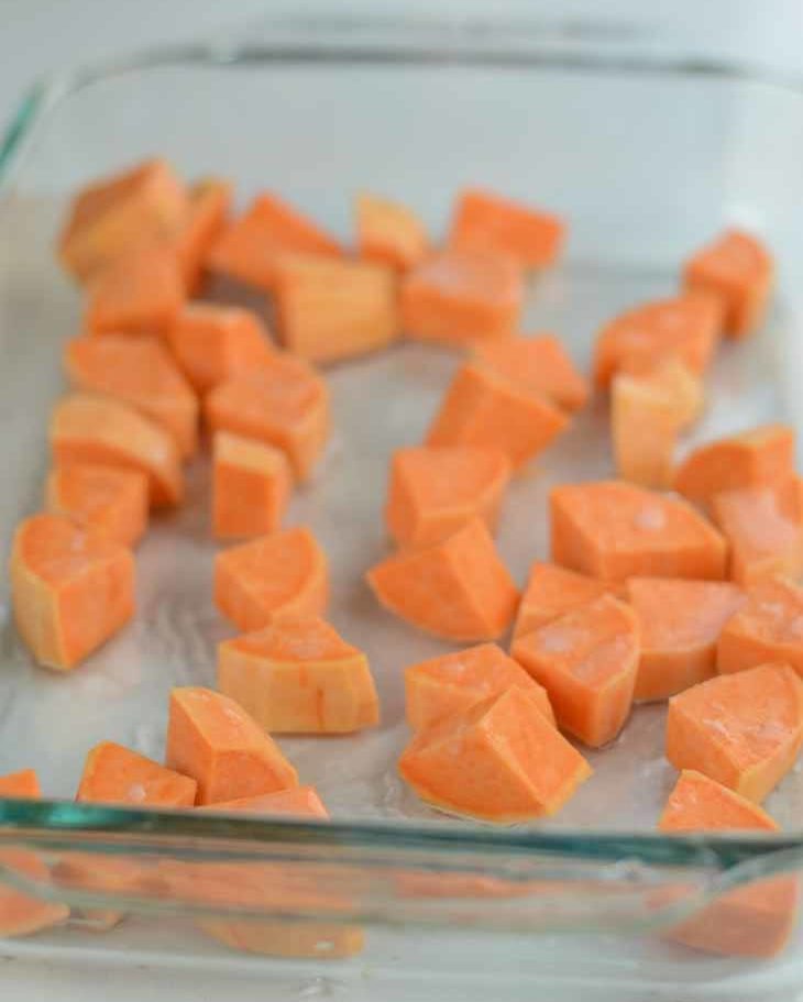 Preheat oven to 375F. Peel and then cube the sweet potato or yam. Mix with 1 tablespoon of coconut oil and place in a large baking dish (3 quart or 2.8 liter). I used a 9 by 13 inch dish. Bake the sweet potato cubes for 30 minutes.