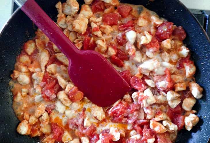 Add in the can of diced tomatoes and add in salt to taste. Place on a simmer and cook the liquid down.