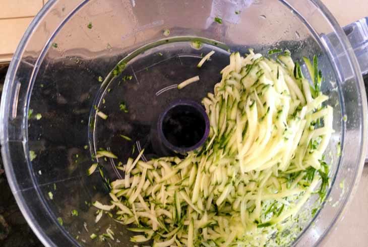In the meantime, prepare the pasta. If using zucchinis, shred them in the food processor or use a julienne peeler or a spiralizer. If using spaghetti squash, chop it in half, remove the seeds, cover lightly with some coconut oil and microwave each half for 7 minutes.