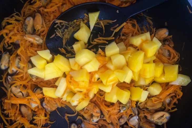 Add in the mangoes - Paleo Carrot Mango Mussels Hash Recipe [Paleo, AIP] #paleo #autoimmune #aip #recipe https://paleoflourish.com/carrot-mango-mussels-hash-recipe-paleo-aip