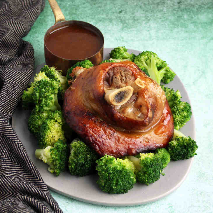 Paleo Crockpot Pork Shanks and Gravy Recipe #paleo https://paleoflourish.com/paleo-crockpot-pork-shanks-gravy-recipe