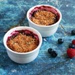 Paleo Mini Mixed Berry Crumbles Recipe #paleo https://paleoflourish.com/paleo-mini-mixed-berry-crumbles-recipe