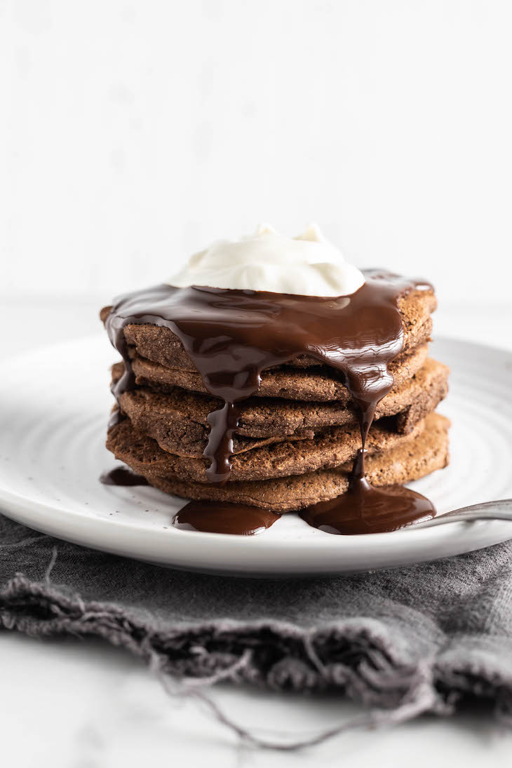 Paleo Hot Chocolate Pancakes Recipe #paleo #recipe https://paleoflourish.com/paleo-hot-chocolate-pancakes-recipe/
